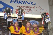 Timo Bernhard, Romain Dumas and Emmanuel Collard celebrate the team's overall win at Sebring
